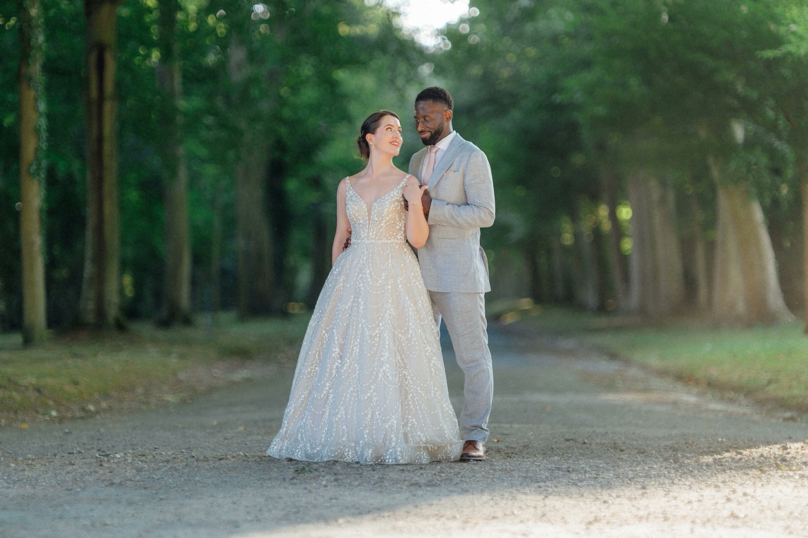 Serge and Cesca walking through woodland in France