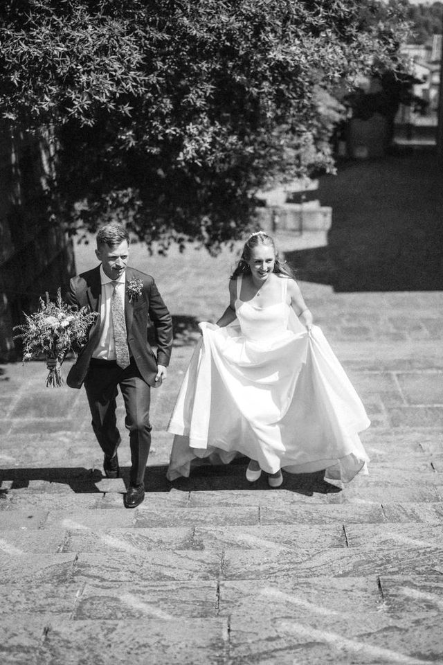 Black and white photograph of a couple walking together