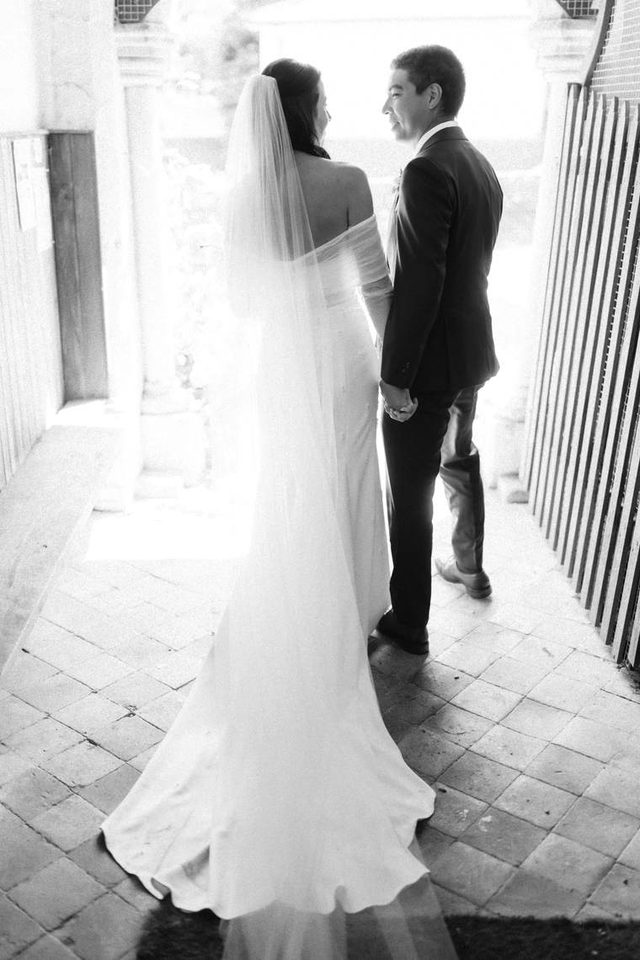 Black and white photograph of a bride's dress train