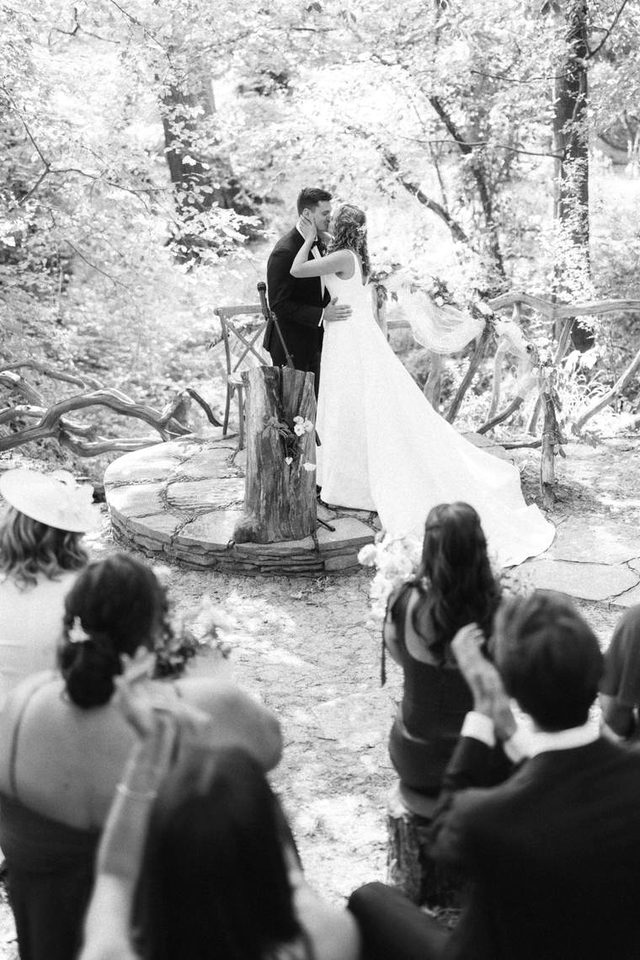 Black and white portrait of a couple on a bridge