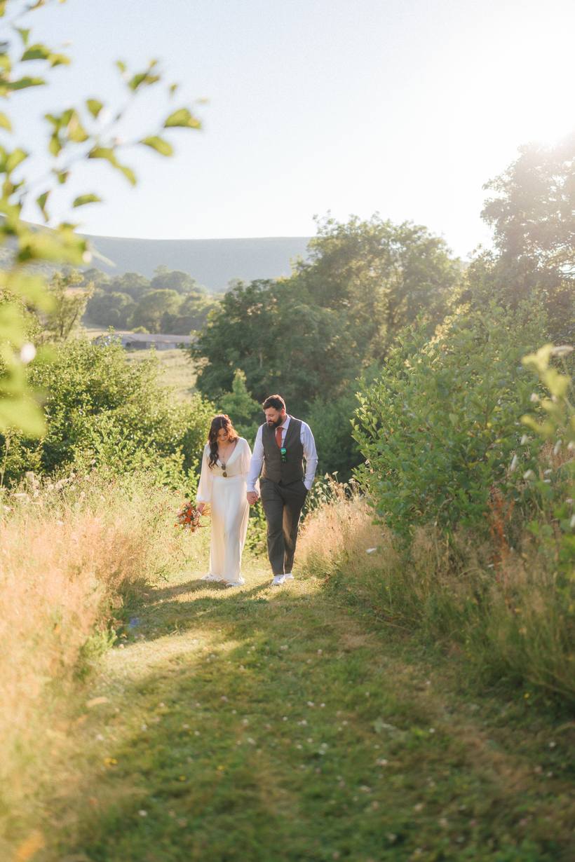 A couple beside a woodland waterfall