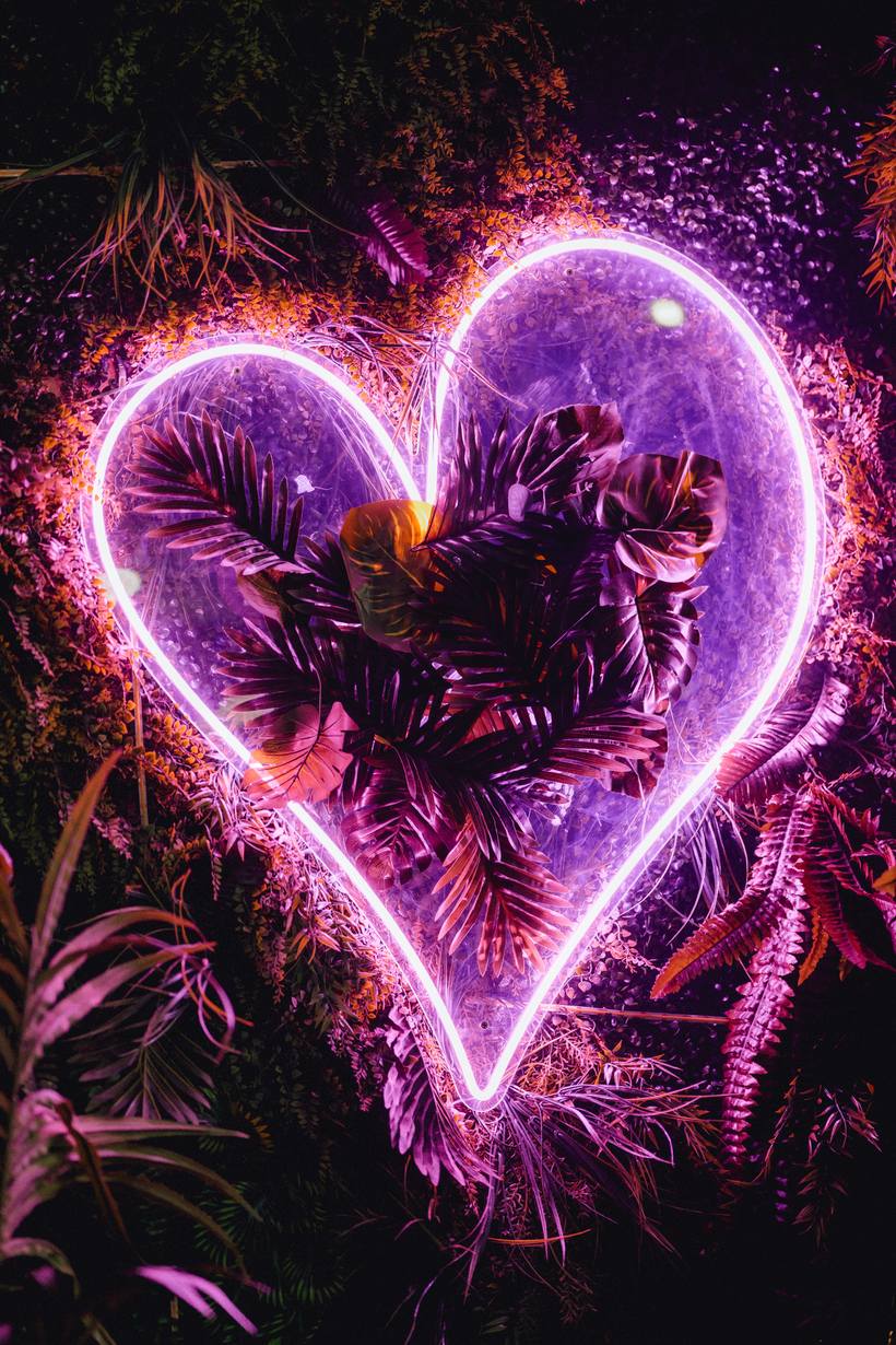A neon sign glowing above the dancefloor