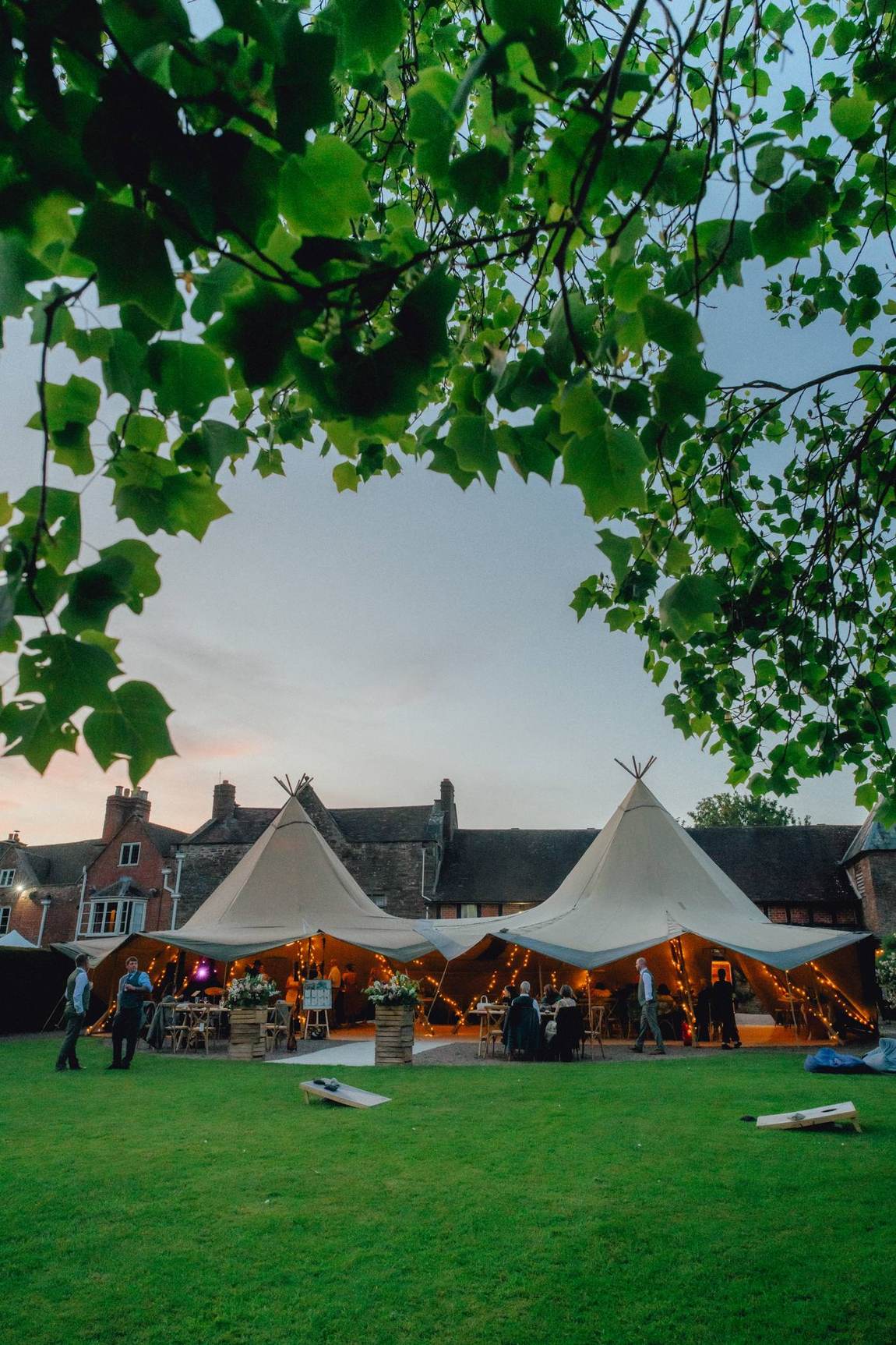 A marquee glowing warmly against the night sky